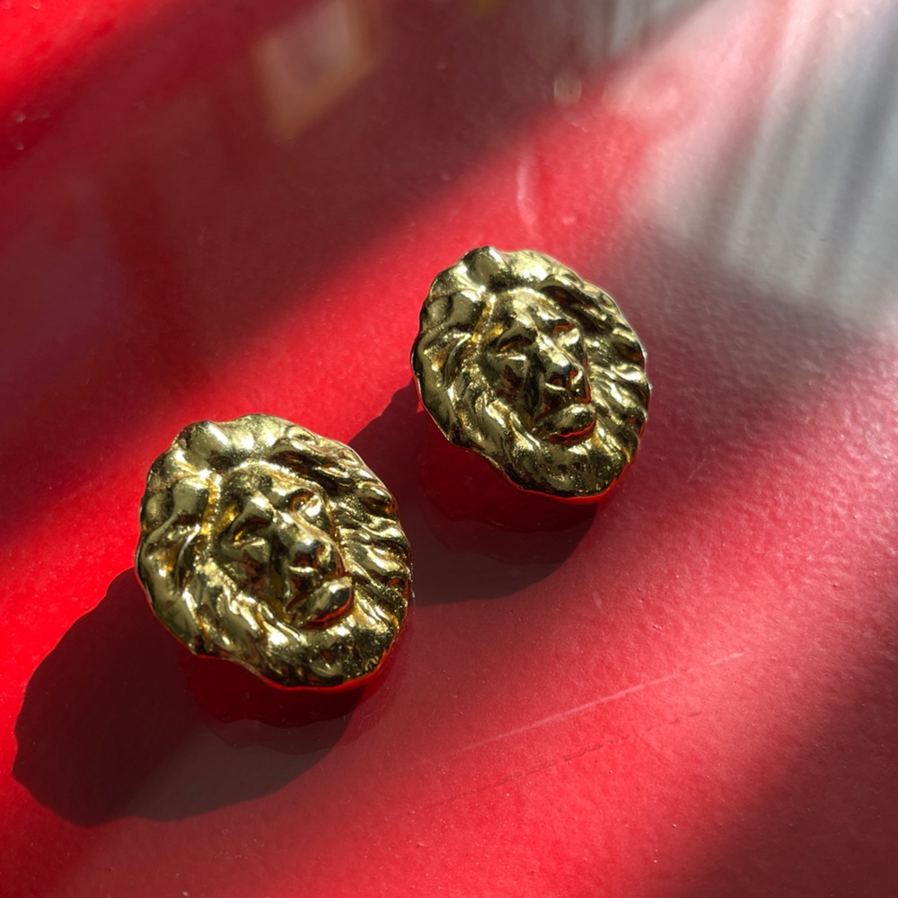 Gold lion head door knocker style earrings
